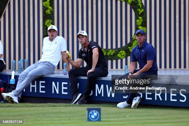 Ludvig Aberg of Sweden, Viktor Hovland of Norway and Rory McIlroy of Northern Ireland wait on the 14th tee on Day Two of the BMW PGA Championship at...