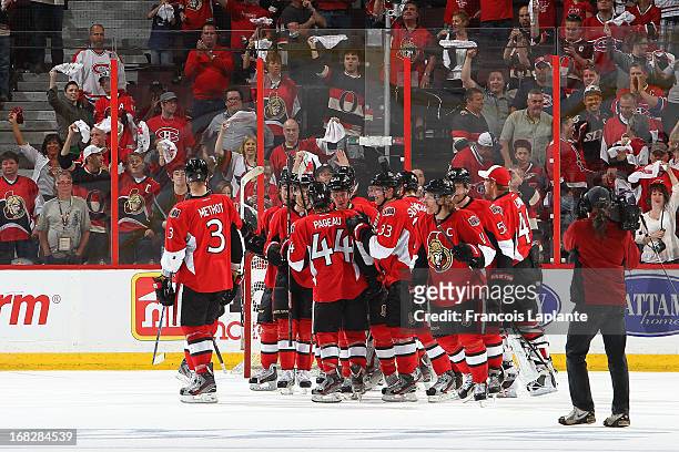 Members of the Ottawa Senators celebrate a 6-1 victory against the Montreal Canadiens in Game Three of the Eastern Conference Quarterfinals during...