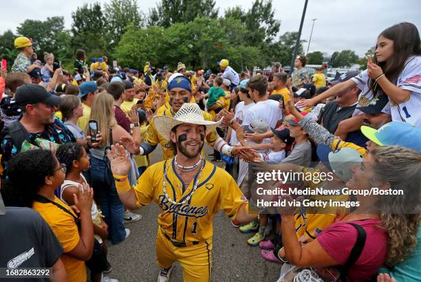 Brockton, Mass., August 16, 2023: Banana Bill Leroy leads the team thru the fans as the Savannah Bananas take on the Party Animals at Campanelli...