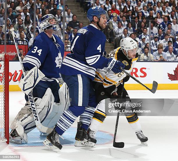 David Krejci of the Boston Bruins battles with Cody Franson of the Toronto Maple Leafs in Game Three of the Eastern Conference Quarterfinals during...