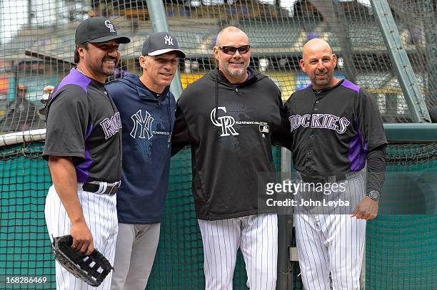 Colorado Rockies Vinny Castilla, New York Yankees manager Joe Girardi, Dante Bichette and Walt Weis all pose for a photo during batting practice May...