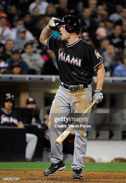 Matt Diaz of the Miami Marlins reacts after a called third strike during the fifth inning of a baseball game against the San Diego Padres at Petco...