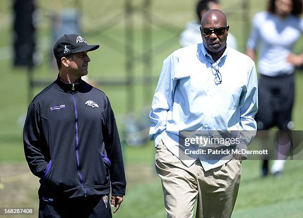 Head coach John Harbaugh of the Baltimore Ravens speaks with general manager Ozzie Newsome after a practice during the Baltimore Ravens rookie camp...