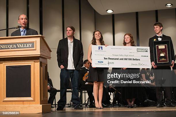 Principal Dr. Robert McBride, President of the Chicago chapter of the Recording Academy Matt Hennessy, and students Caroline Brown, Mary Beth...