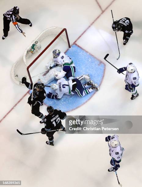Joe Pavelski of the San Jose Sharks celebrates alongside Patrick Marleau and Logan Couture after scoring a third-period power-play goal past...