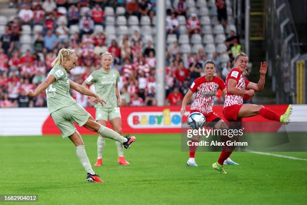 Pernille Harder of FC Bayern München shoots but has the shot blocked by Greta Stegemann of Sport-Club Freiburg during the Google Pixel Women's...