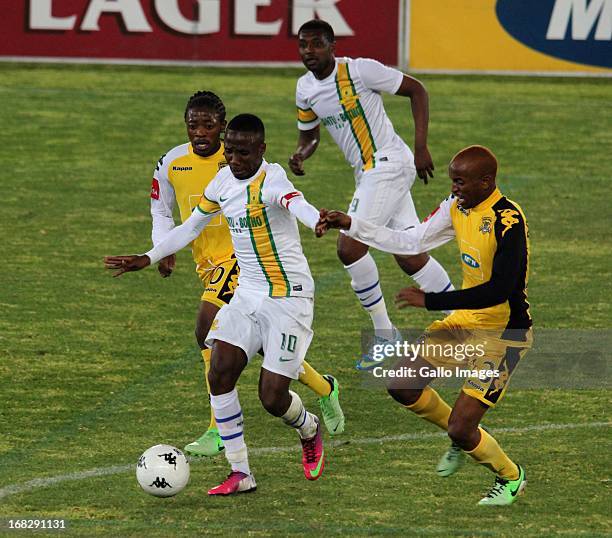 Teko Modise of Mamelodi Sundowns is challenged by Tiyani Mabunda of Black Leopards during the Absa Premiership match between Black Leopards and...