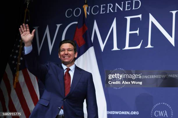 Republican U.S. Presidential candidate and Florida Gov. Ron DeSantis waves as he arrives to address the Concerned Women for America Legislative...