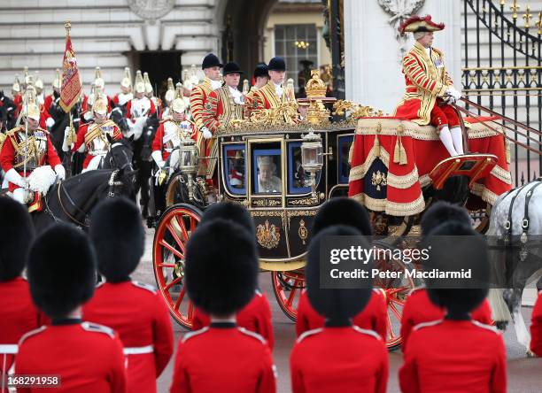 Queen Elizabeth II travels by coach to the State Opening of Parliament on May 8, 2013 in London, England. Queen Elizabeth II will unveil the...