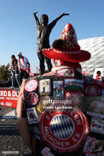 General view of on the outside of the stadium as a Statue of Gerd Mueller can be seen as fans gather prior to the Bundesliga match between FC Bayern...