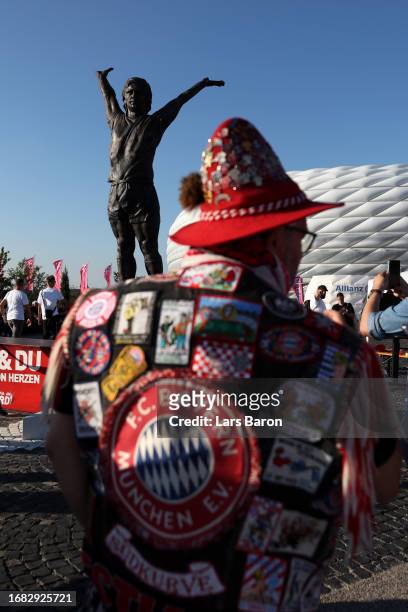 General view of on the outside of the stadium as a Statue of Gerd Mueller can be seen as fans gather prior to the Bundesliga match between FC Bayern...