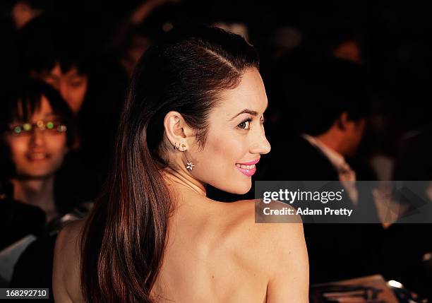 Olga Kurylenko poses for photographs and signs autographs while attending the 'Oblivion' Japan Premiere at Roppongi Hills on May 8, 2013 in Tokyo,...