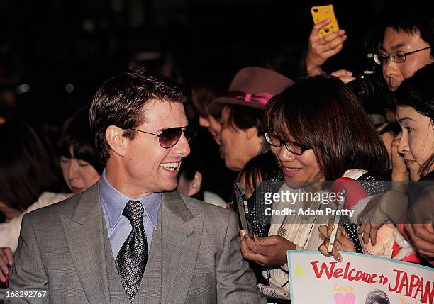 Tom Cruise poses for photographs and signs autographs while attending the 'Oblivion' Japan Premiere at Roppongi Hills on May 8, 2013 in Tokyo, Japan....
