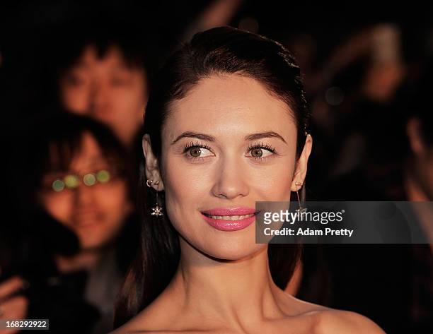 Olga Kurylenko poses for photographs and signs autographs while attending the 'Oblivion' Japan Premiere at Roppongi Hills on May 8, 2013 in Tokyo,...