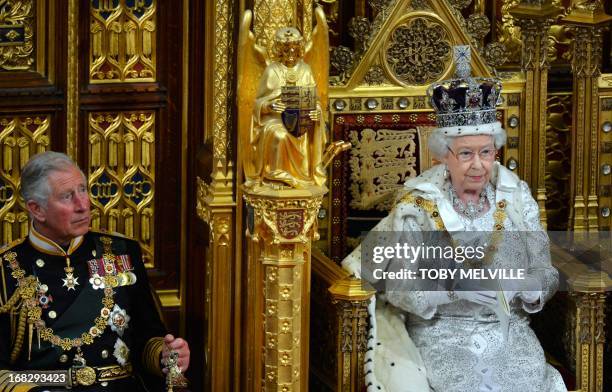 Britain's Queen Elizabeth delivers her speech during the State Opening of Parliament at the House of Lords, alongside Prince Charles in London May 8,...