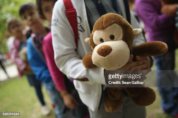 Visiting children wait with their stuffed animals to have them diagnosed at the Teddy Bear Clinic at Charite Hospital on May 8, 2013 in Berlin,...