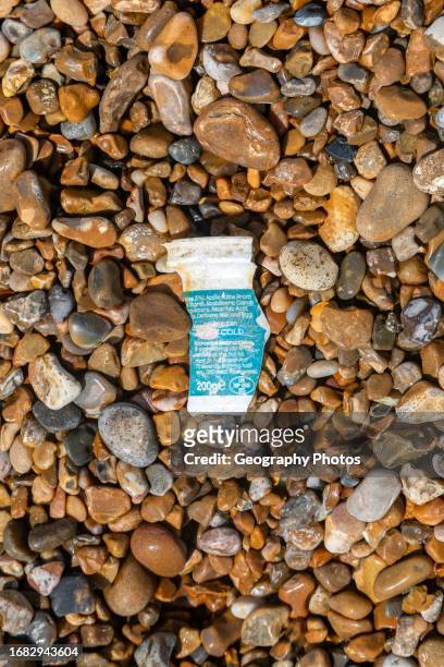 Fragment of polystyrene food package washed up on shingle beach, Shingle Street, Suffolk, England, UK,.