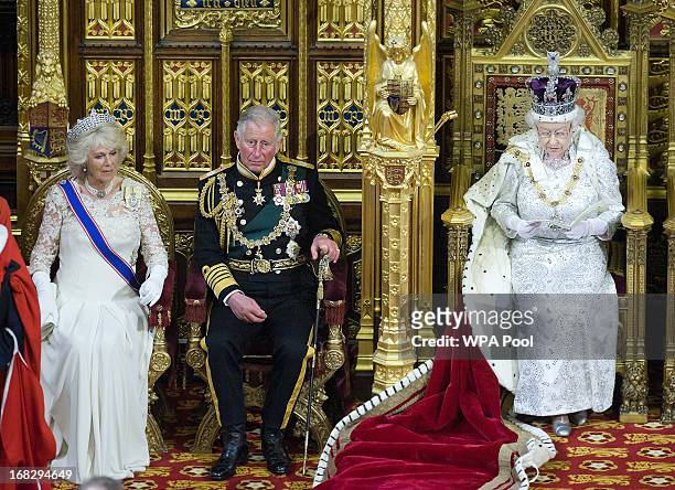 Camilla, Duchess of Cornwall and Prince Charles, Prince of Wales listen as Queen Elizabeth II delivers her speech during the the State Opening of...