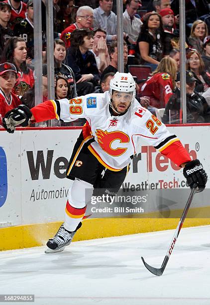 Akim Aliu of the Calgary Flames skates around the boards during the NHL game against the Chicago Blackhawks on April 26, 2013 at the United Center in...