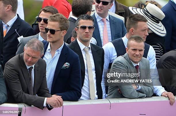 Manchester United players, Dutch striker Robin van Persie , English defender Phil Jones and English midfielder Tom Cleverley watch the action at the...