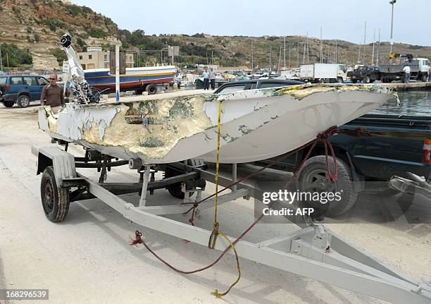 The dinghy belonging to the motor yacht "El Pirata" is pictured after being brought ashore on May 8, 2013 at Mgarr harbor in Gozo, one of three...