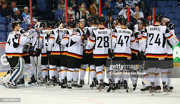 The team of Germany celebrate after the IIHF World Championship group H match between Austria and Germany at Hartwall Areena on May 8, 2013 in...