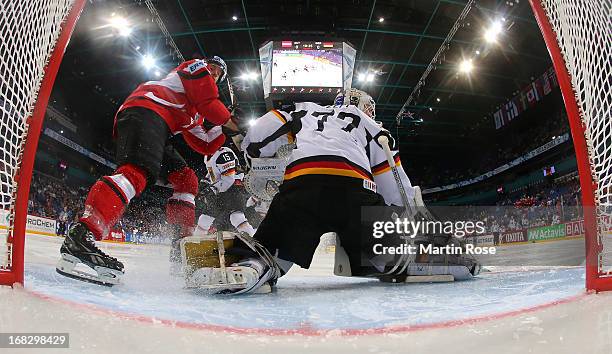 Daniel Welser of Austria fails to score over Rob Zepp , goaltender of Germany during the IIHF World Championship group H match between Austria and...