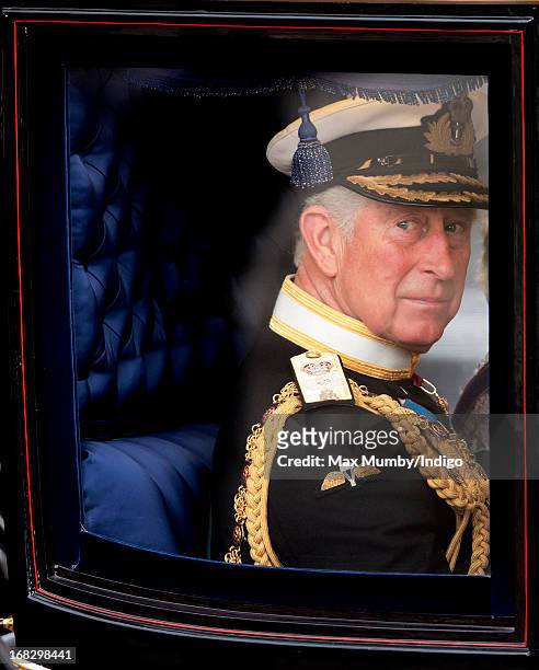 Prince Charles, Prince of Wales travels in a horse drawn carriage from Buckingham Palace to attend the State Opening of Parliament on May 8, 2013 in...