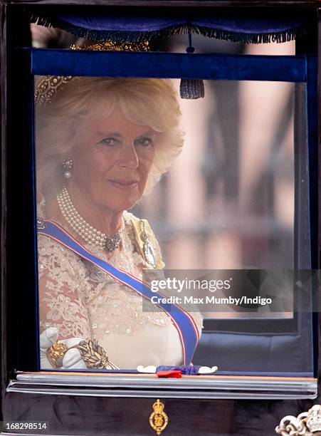 Camilla, Duchess of Cornwall travels in a horse drawn carriage from Buckingham Palace to attend the State Opening of Parliament on May 8, 2013 in...