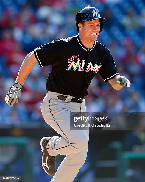 Matt Diaz of the Miami Marlins runs to first base against the Philadelphia Phillies in an MLB baseball game on May 5, 2013 at Citizens Bank Park in...