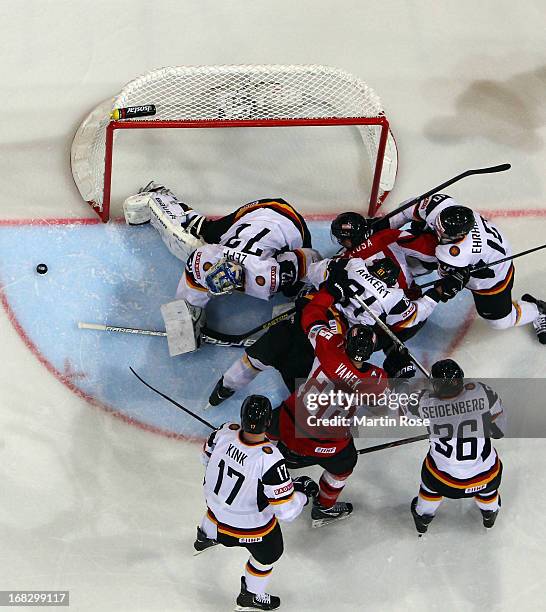 Manuel Latusa of Austria fails to score over Rob Zepp , goaltender of Germany during the IIHF World Championship group H match between Austria and...
