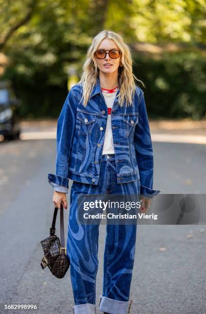 Guest wears denim jacket, jeans, Fendi bagoutside Bora Aksu during London Fashion Week September 2023 on September 15, 2023 in London, England.