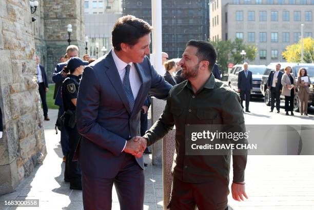 Ukrainian President Volodymyr Zelensky greets Canadian Prime Minister Justin Trudeau on arrival at Parliament Hill in Ottawa, Canada, on September...