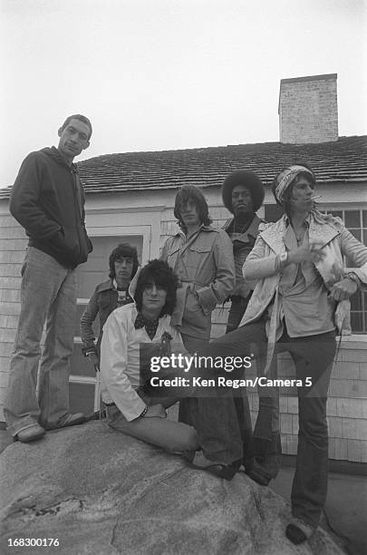 The Rolling Stones are photographed with a session musician at artist Andy Warhol's home in 1975 in Montauk, New York. CREDIT MUST READ: Ken...