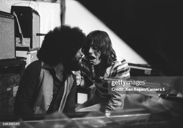 Mick Jagger of the Rolling Stones is photographed with sesison musician at artist Andy Warhol's home in 1975 in Montauk, New York. CREDIT MUST READ:...