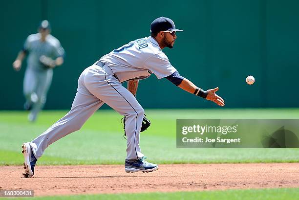 Robert Andino of the Seattle Mariners tosses the ball to second base during the second inning against the Pittsburgh Pirates on May 8, 2013 at PNC...