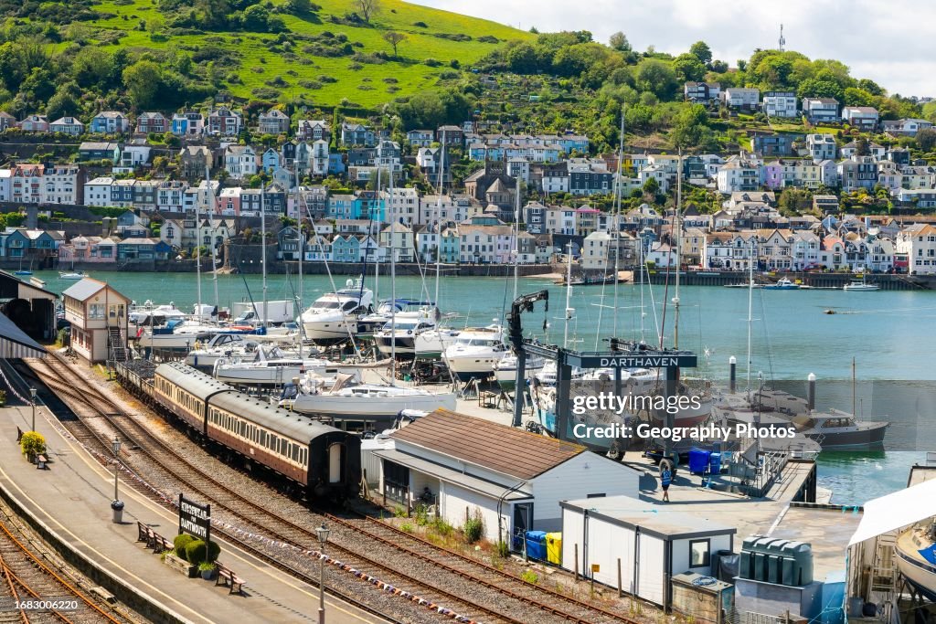 View across Kingswear railway station and River Dart estuary to Dartmouth, Devon, England, UK