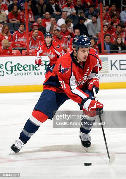 Steven Oleksy of the Washington Capitals controls the puck against the New York Rangers in Game One of the Eastern Conference Quarterfinals during...