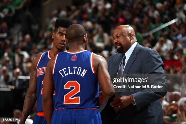 Mike Woodson of the New York Knicks talks with Iman Shumpert and Raymond Felton during the game against the Boston Celtics in Game Four of the...