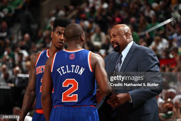 Mike Woodson of the New York Knicks talks with Iman Shumpert and Raymond Felton during the game against the Boston Celtics in Game Four of the...