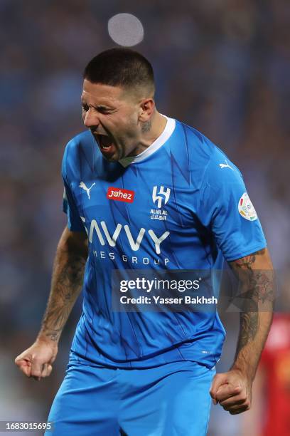 Aleksandar Mitrovic of Al Hilal celebrates after scoring the team's first goal during the match between Al-Hilal and Riyadh at Prince Faisal Bin...