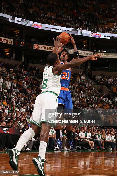 Iman Shumpert of the New York Knicks takes a jump shot against Jeff Green of the Boston Celtics in Game Four of the Eastern Conference Quarterfinals...