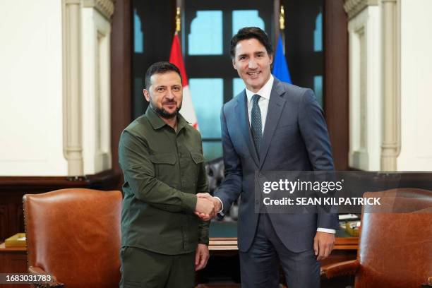 Ukrainian President Volodymyr Zelensky shakes hands with Canadian Prime Minister Justin Trudeau at Parliament Hill in Ottawa, Canada, on September...