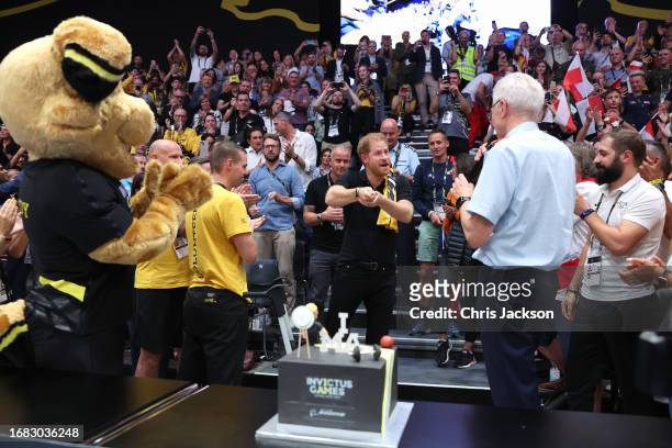 Prince Harry, Duke of Sussex is presented with a Invitus Games themed cake for his 39th birthday during the sitting volleyball finals at the Merkur...