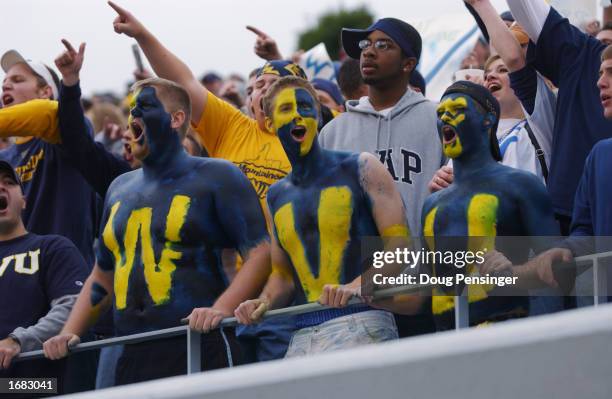 Fans of the West Virginia University Mountaineers cheer on their team during a Big East game against the University of Miami Hurricanes on October...