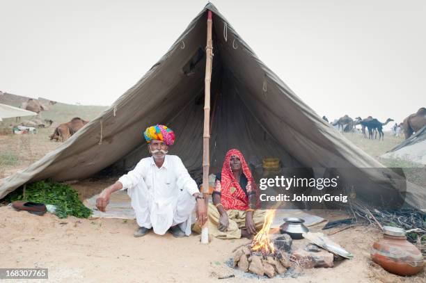 senior indian tribal couple - pushkar fair - reportage portrait stock pictures, royalty-free photos & images