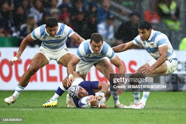 Samoa's fly-half Christian Leali'ifano is tackled by Argentina's wing Emiliano Boffelli during the France 2023 Rugby World Cup Pool D match between...