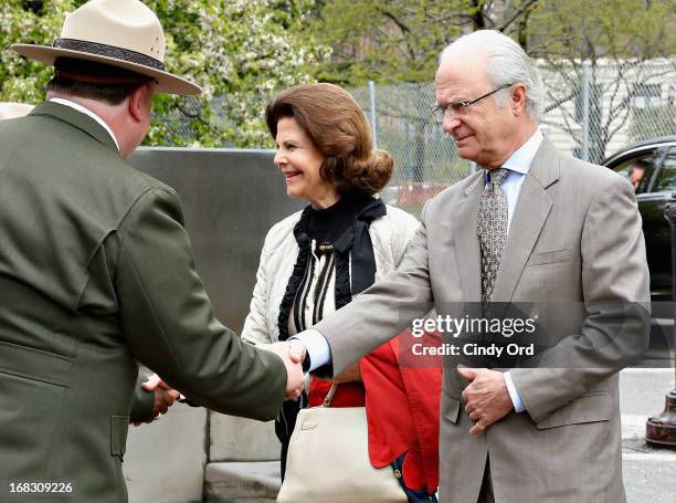 Queen Silvia of Sweden and King Carl XVI Gustaf of Sweden are seen visiting 'The Castle Clinton' in Battery Park on May 8, 2013 in New York City.