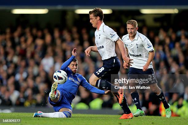 Eden Hazard of Chelsea makes a tackle on Scott Parker of Spurs during the Barclays Premier League match between Chelsea and Tottenham Hotspur at...