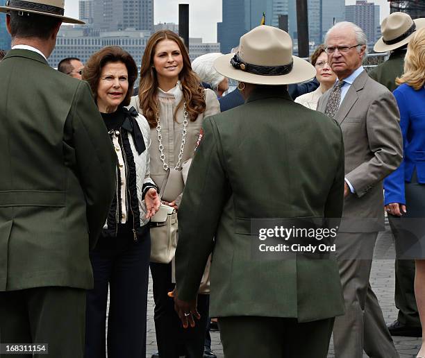 Queen Silvia, Princess Madeleine and King Carl XVI Gustaf of Sweden are seen visiting 'The Castle Clinton' in Battery Park on May 8, 2013 in New York...